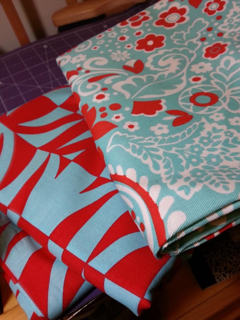 Amy Butler's Sophia Carry-All in red and teal blue fabric. 