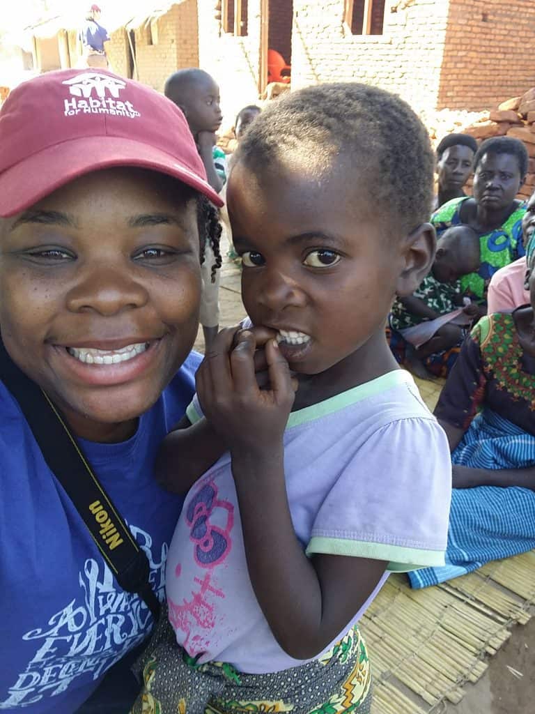 Natasha Nicholes  from Houseful of Nicholes with one of the young ladies from the Salima, Malawi village. 