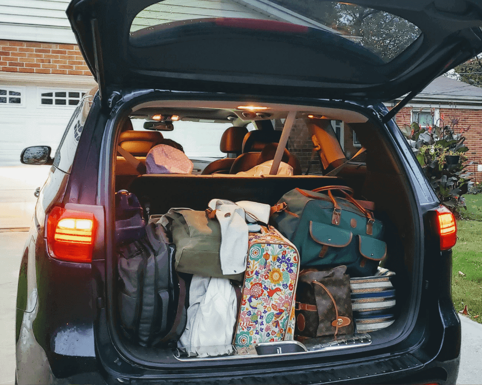 The Kia Sedona trunk is DEEP and spacious. More than enough room for a six or seven person family.